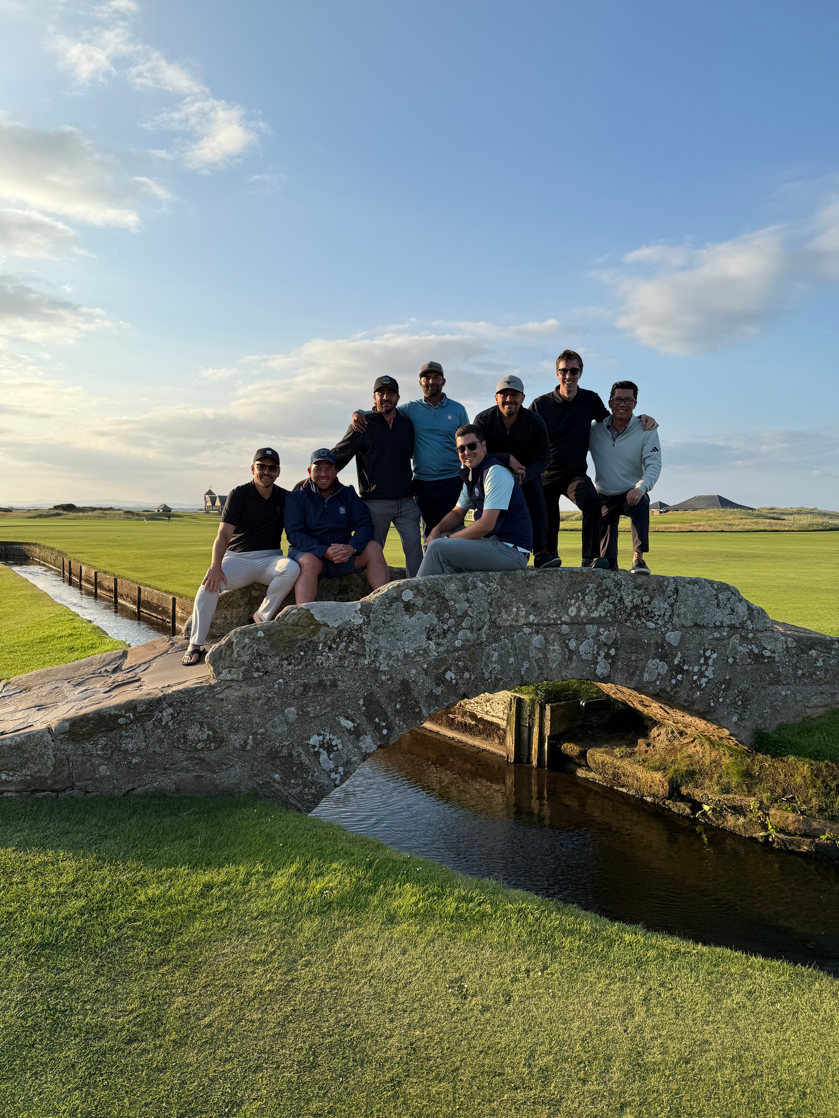 The full field on the Swilcan Bridge at St Andrews, Inaugural Championship 2025